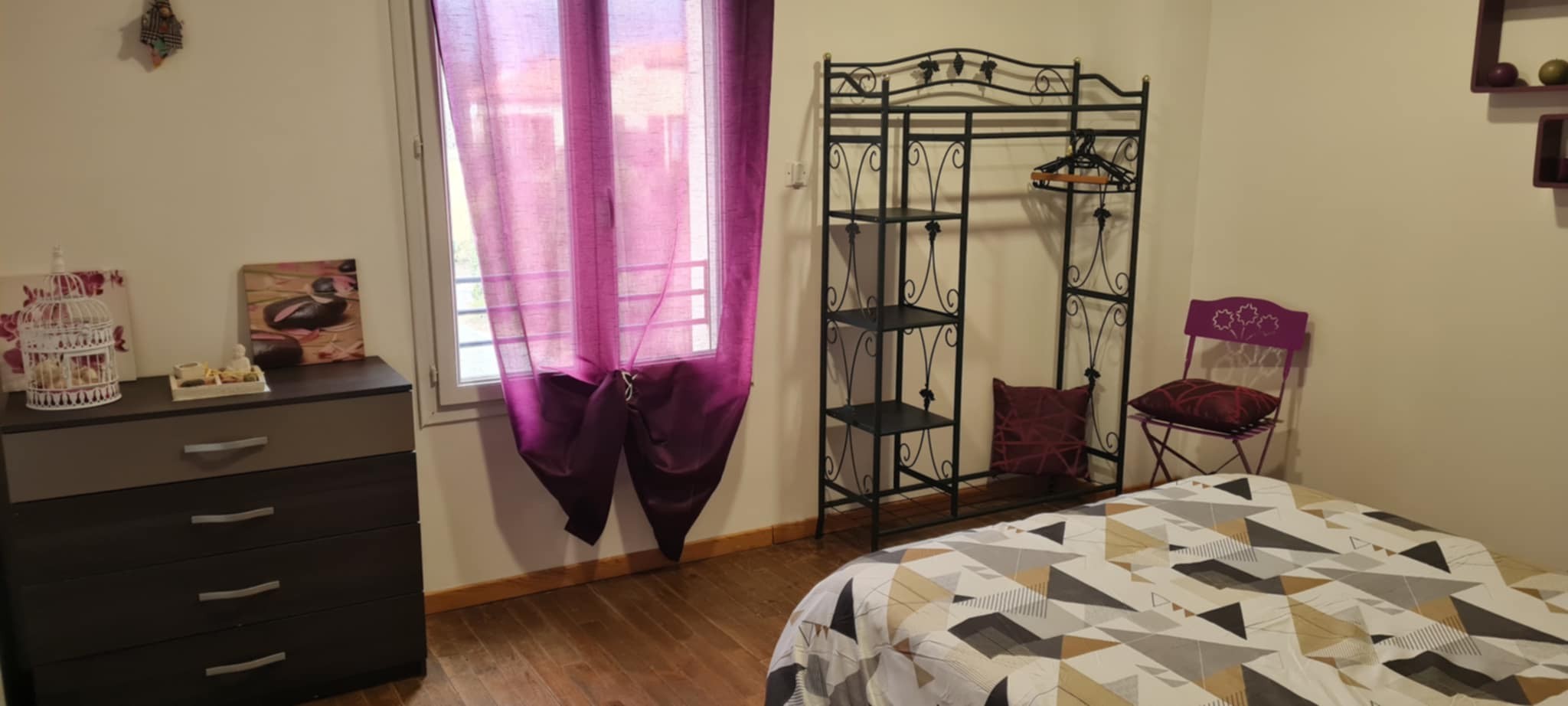 plum-coloured bedroom