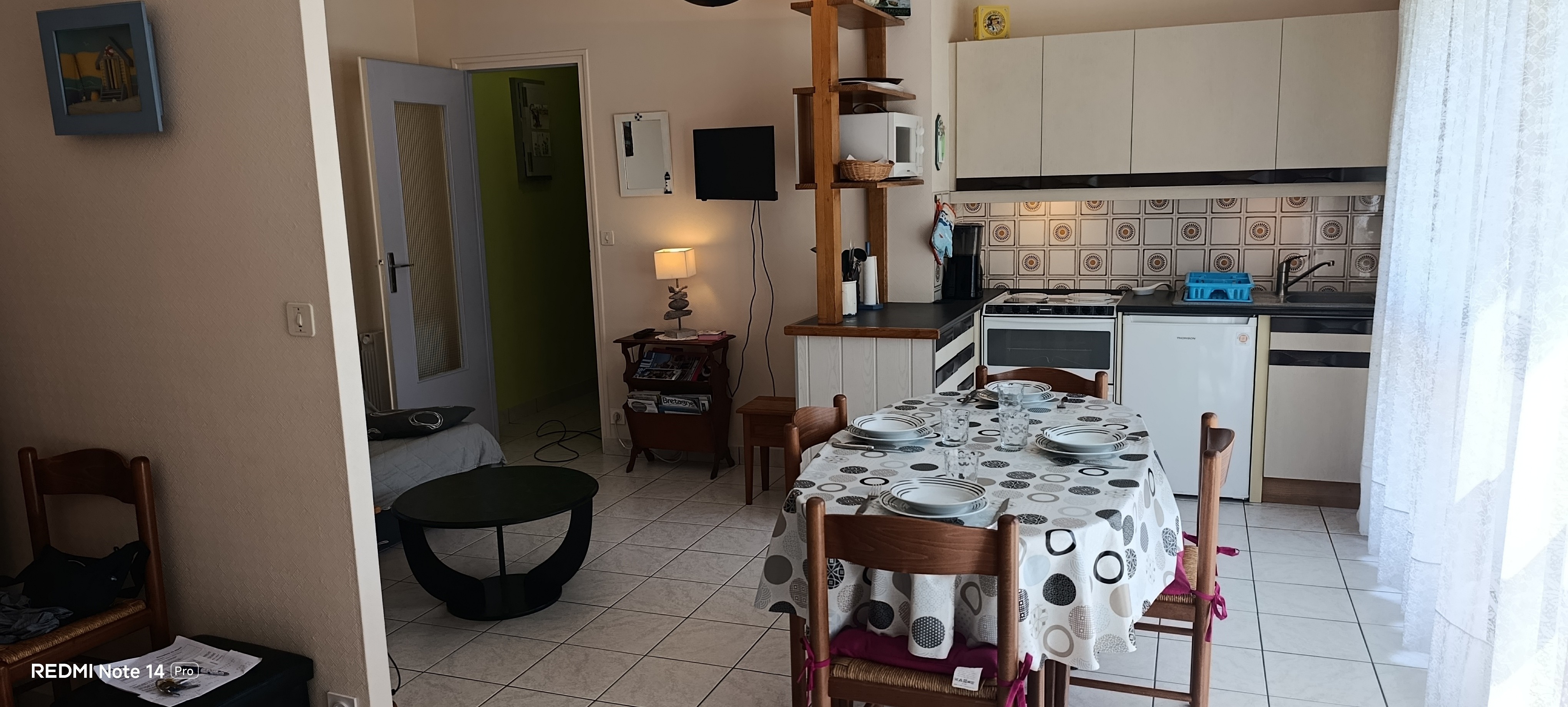 The dining area and kitchen in the living room – “Le Beaulieu” flat