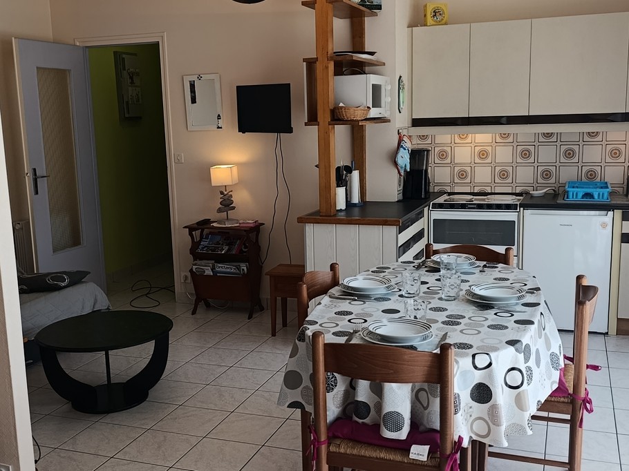 The dining area and kitchen in the living room – “Le Beaulieu” flat