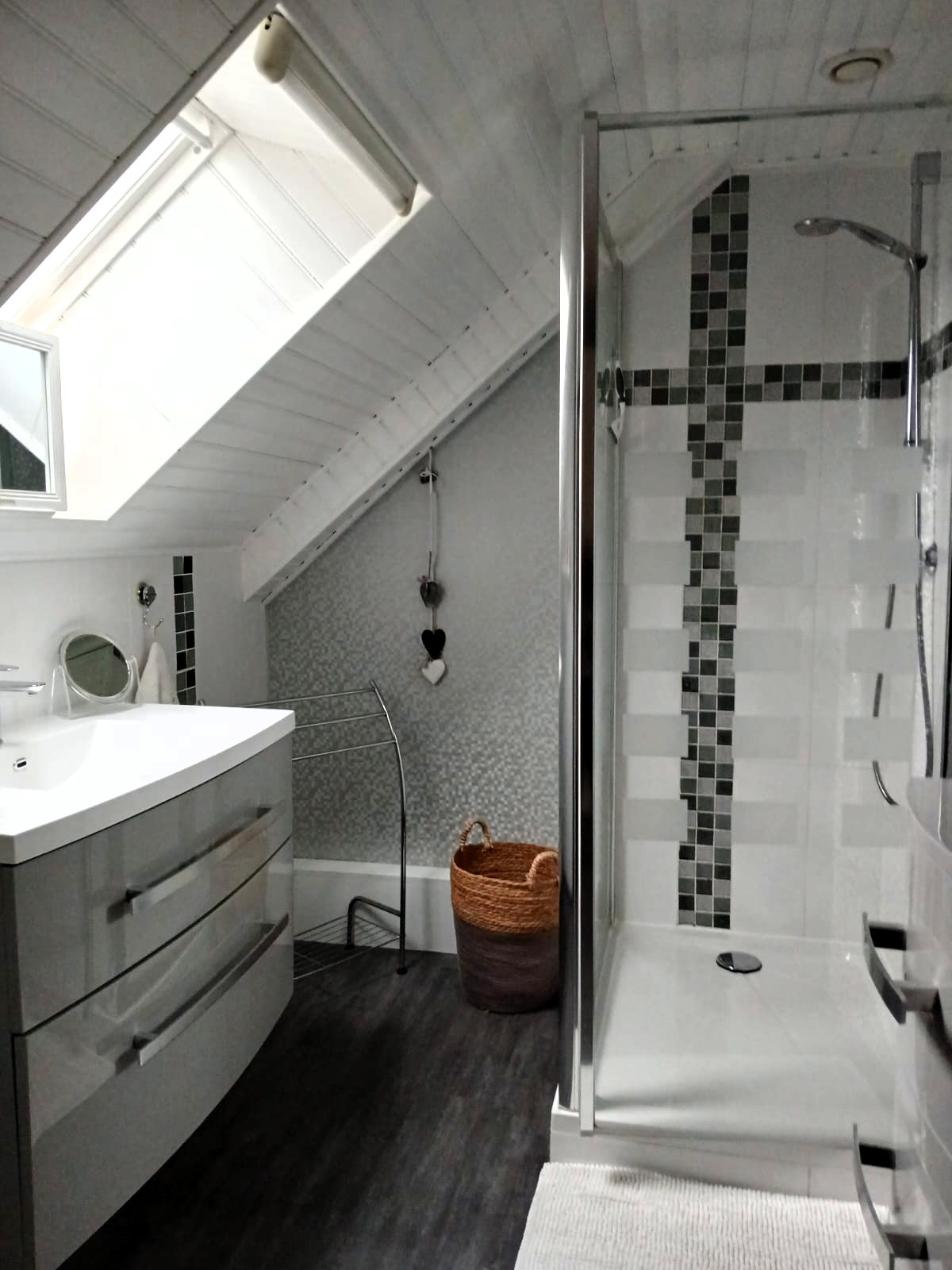Recent shower room with shower, vanity unit and heated towel rail. Separate WC.