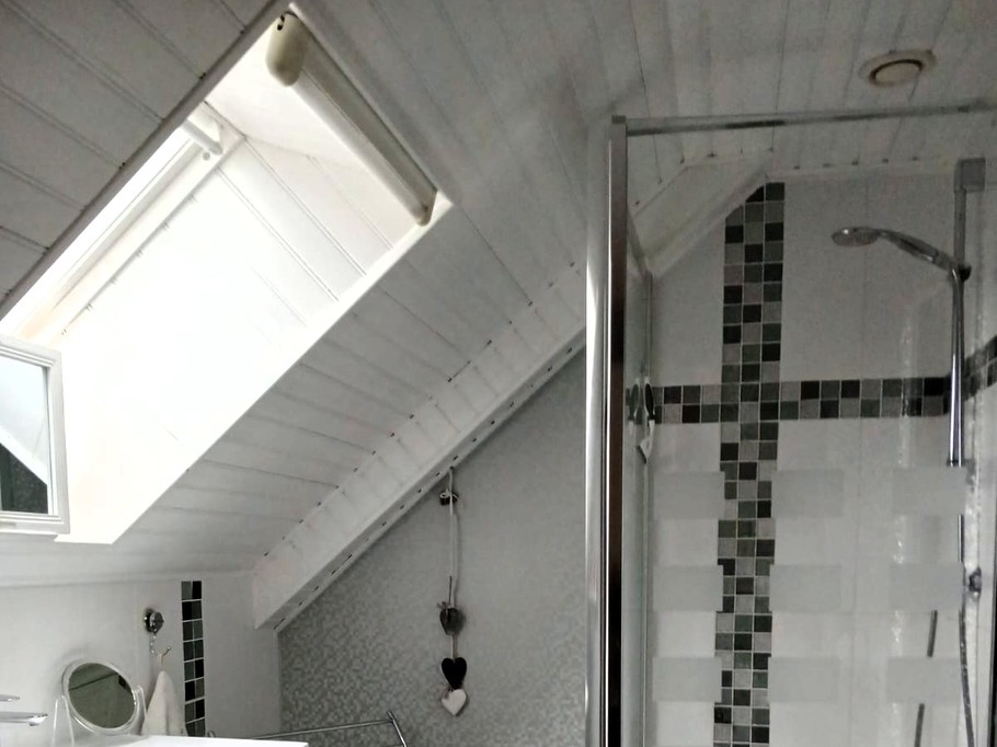 Recent shower room with shower, vanity unit and heated towel rail. Separate WC.