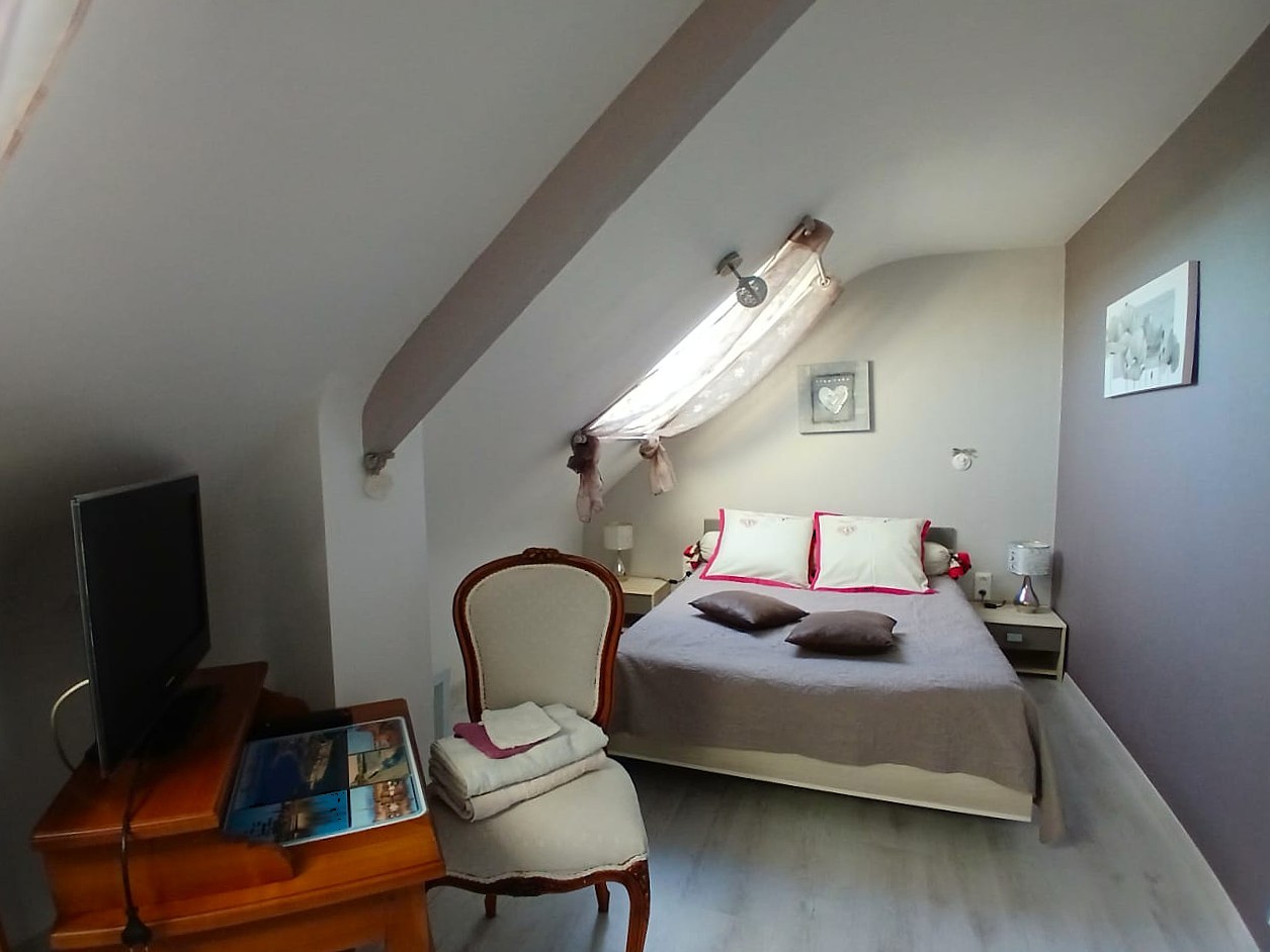 Bedroom 2 - bed 140 x 190 cm with desk, TV, wardrobe and chest of drawers.