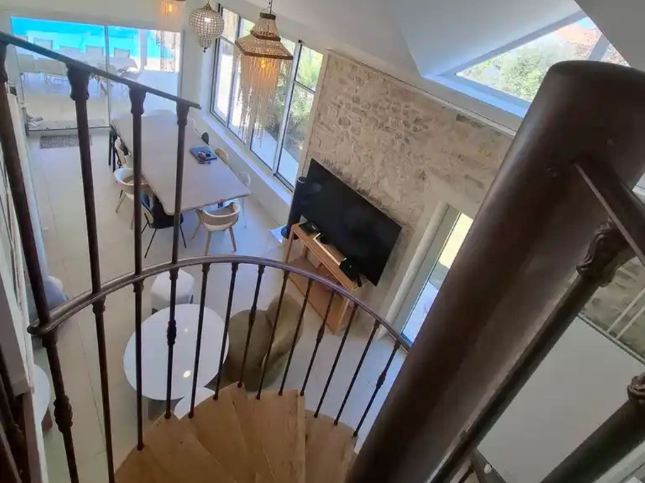 At the top of the stairs leading to the three bedrooms and the shower room