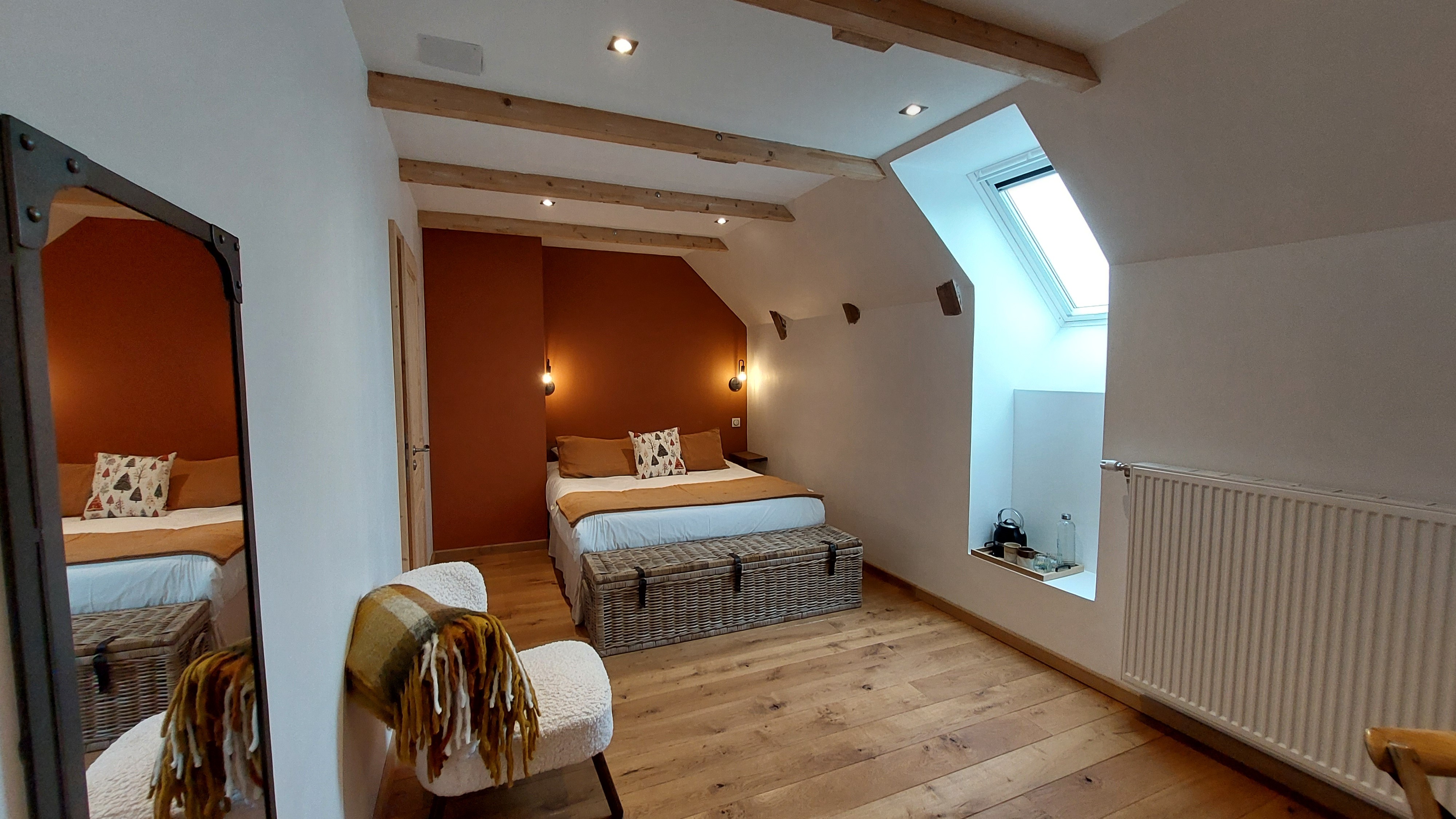 Room with exposed beams in a charming guest house in Auvergne