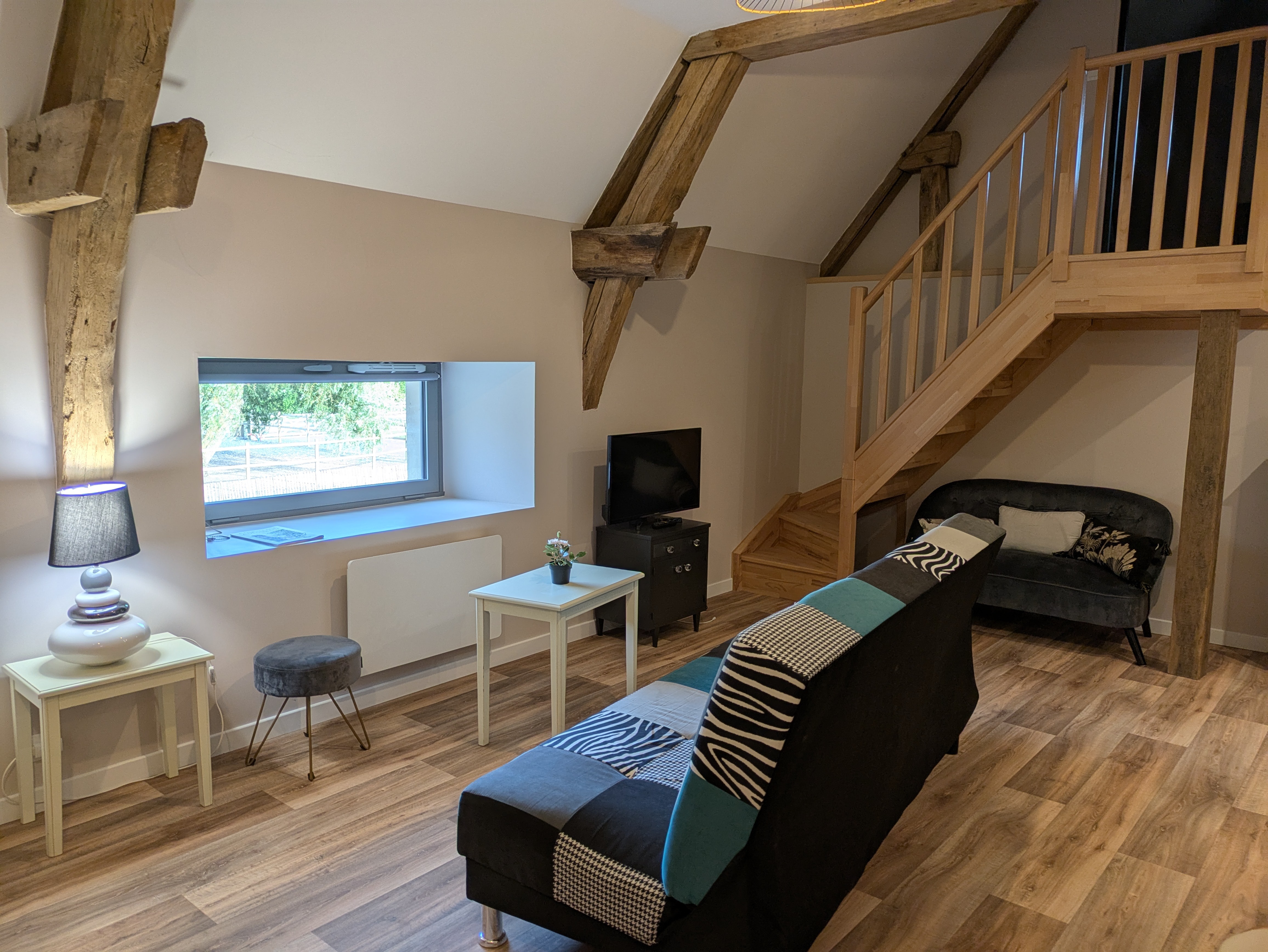 clic clac 2 couchages dans séjour gîte le petit bois