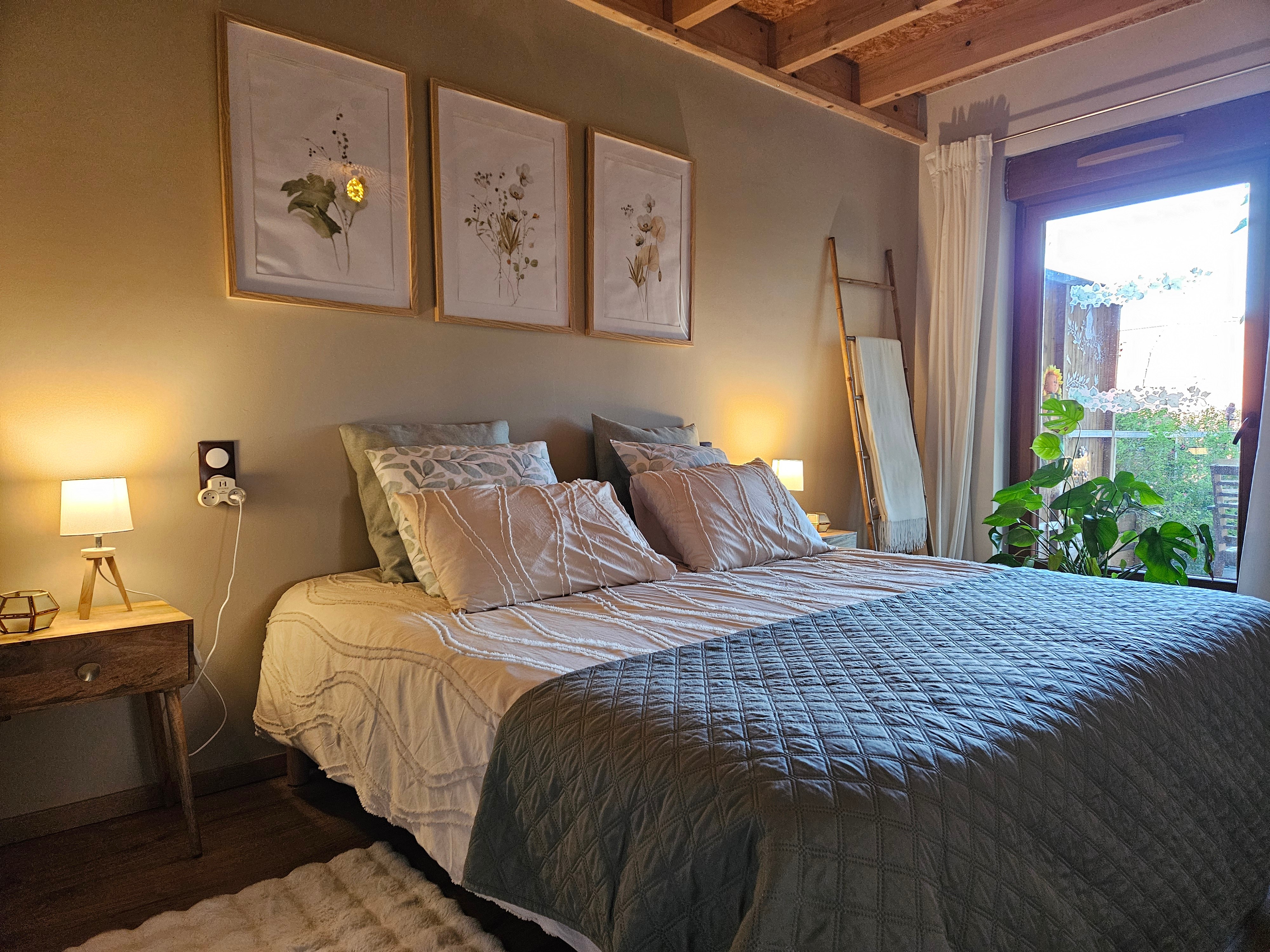 A large double bedroom with a walk-in wardrobe and a desk.