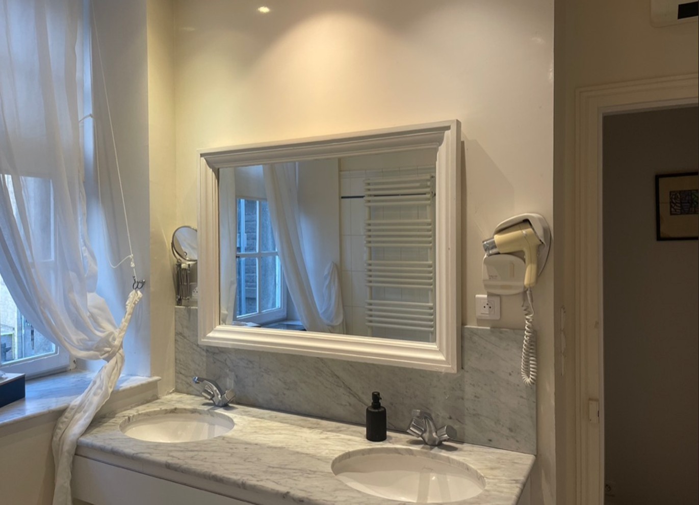 Bathroom with whirlpool bath, large shower and double washbasin unit. Separate WC.