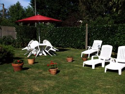 Garden furniture at the back of the house, out of sight
