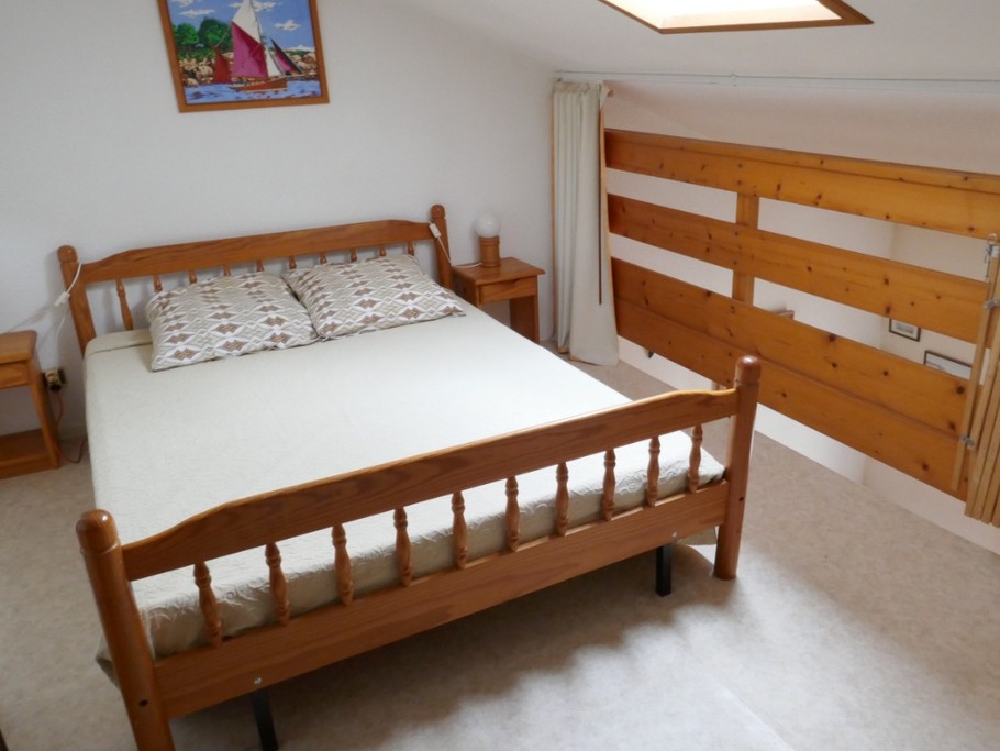 Mezzanine avec un lit en 140