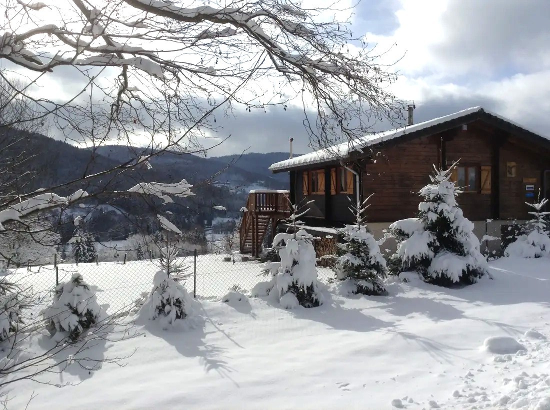 Winter > View from the road of the chalet, the garden and the Cleurie Valley