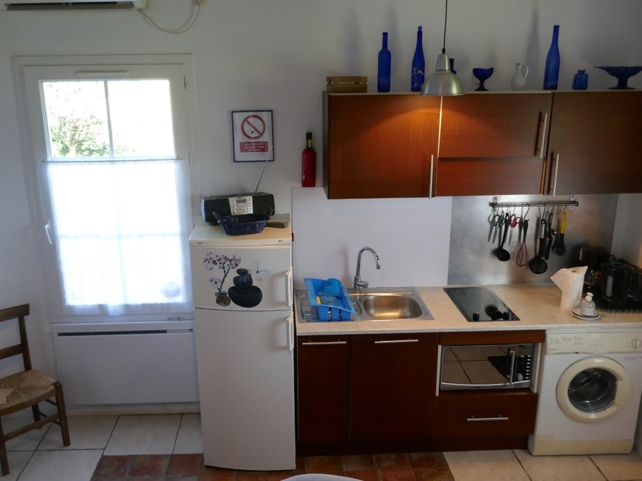 The kitchen opening onto the living room