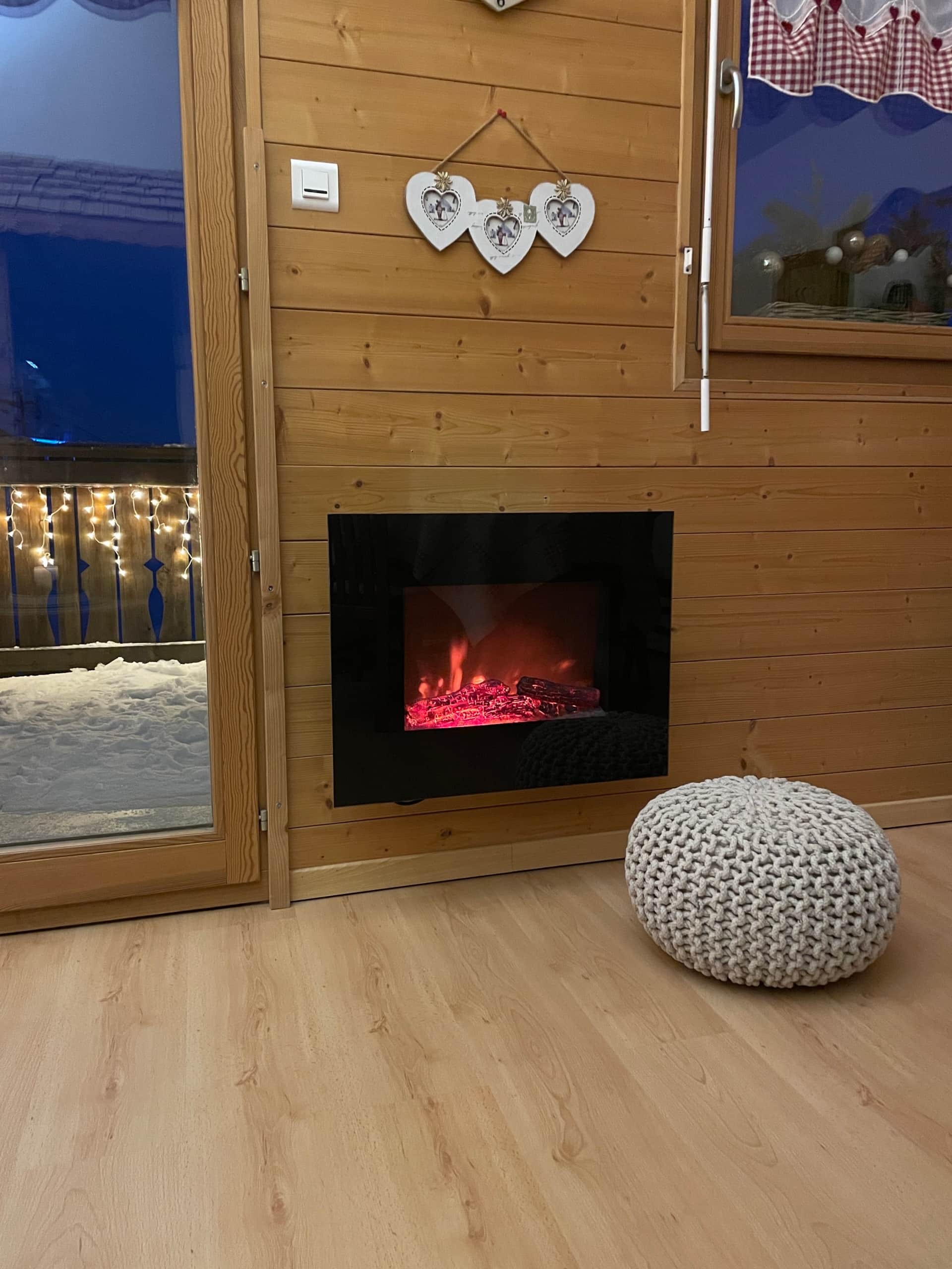 Electric fireplace with a real wood fire effect