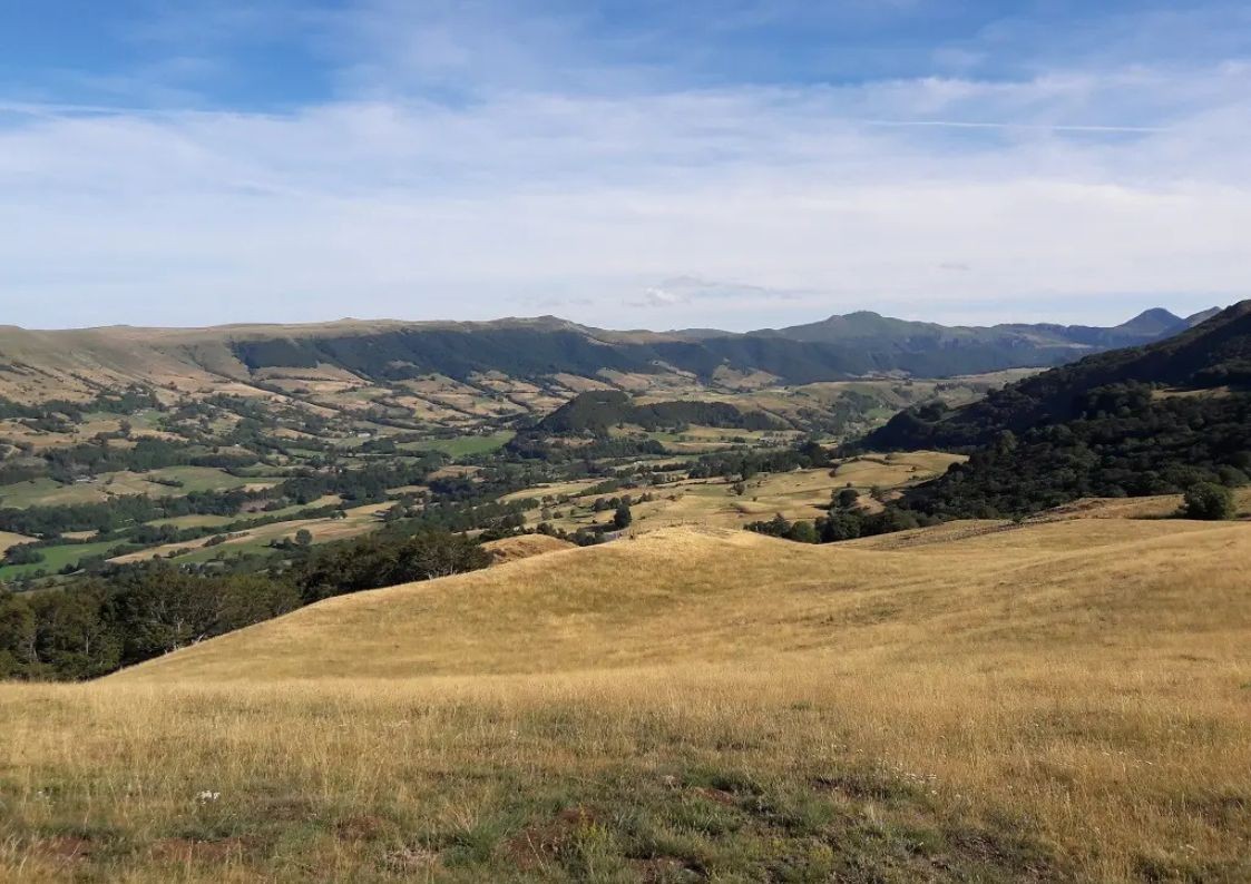 Panoramic view of the valleys and hills of the Parc des Volcans d'Auvergne