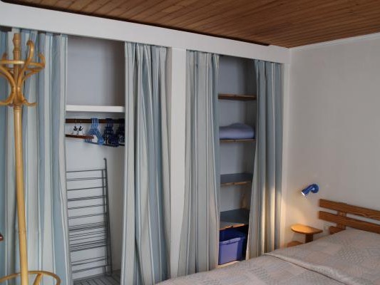 Bedroom with double bed and wardrobe