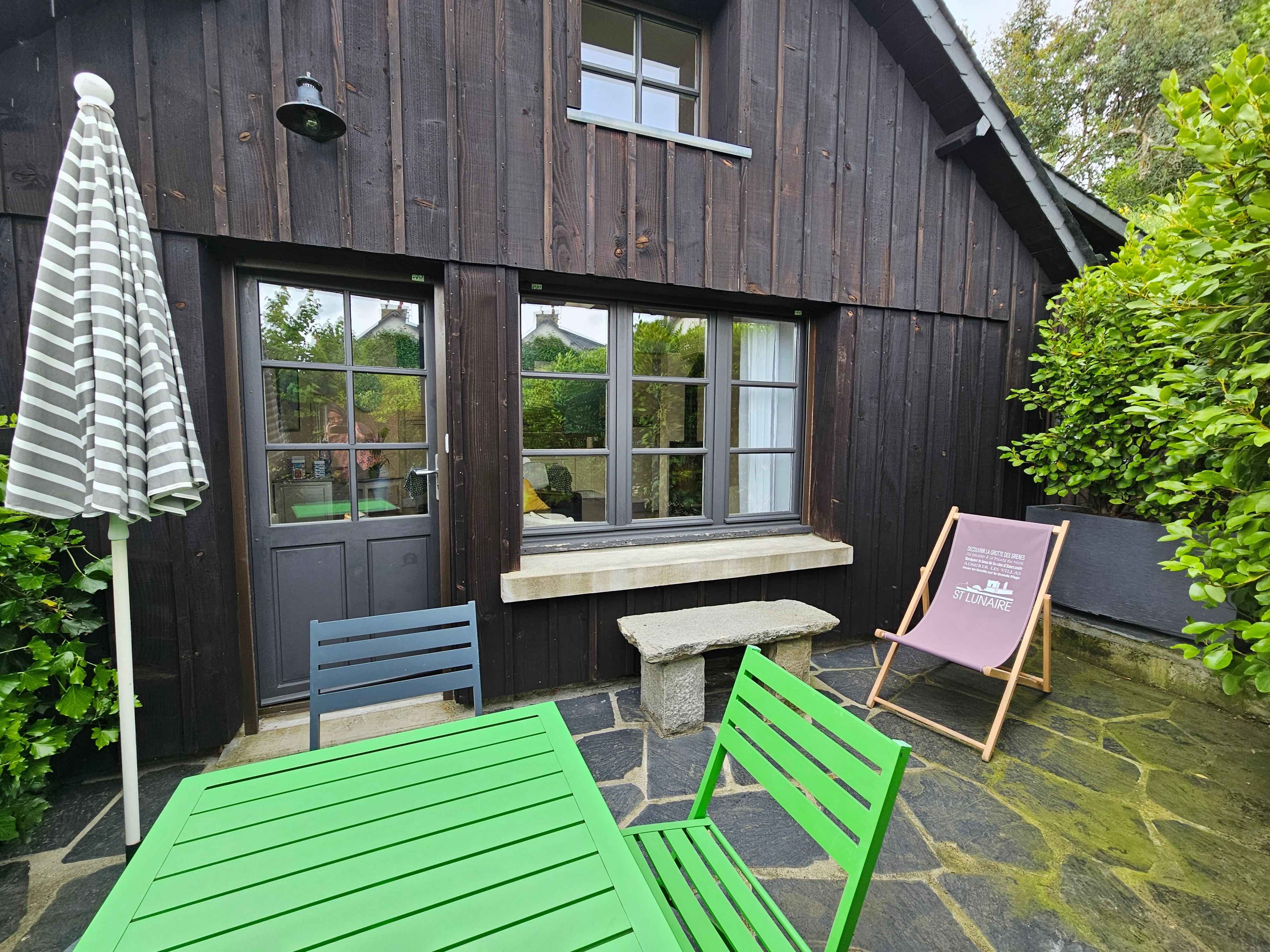 Private terrace with garden furniture and 2 deckchairs.