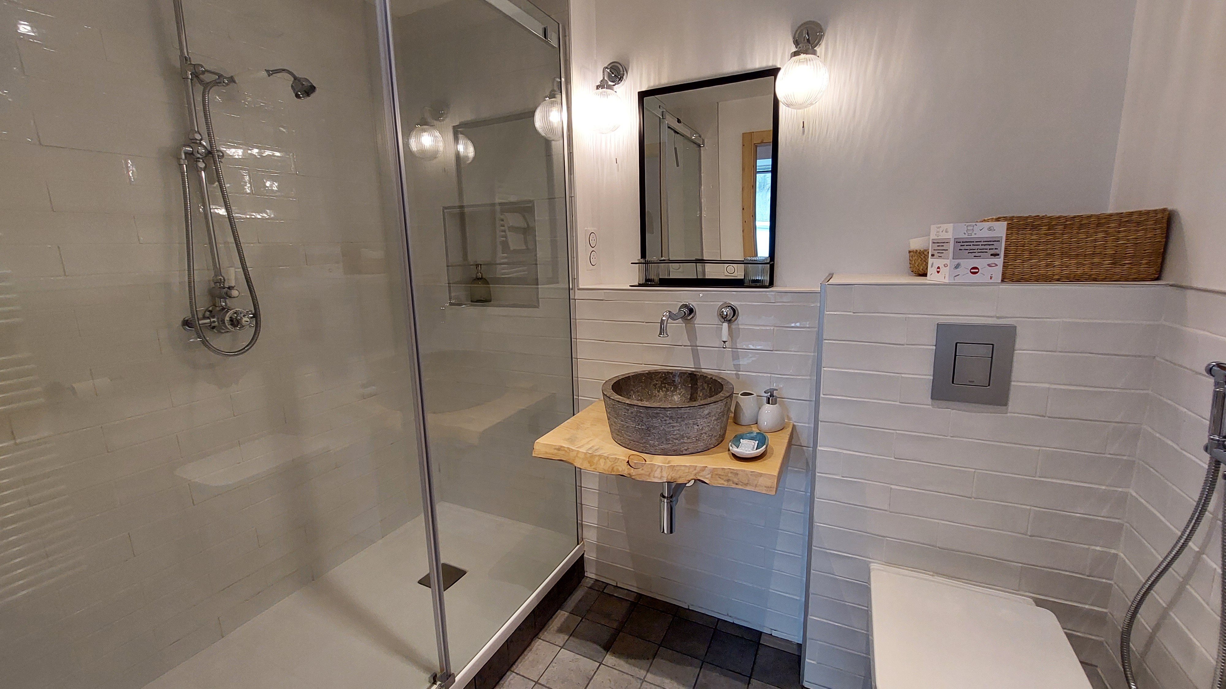 Modern bathroom with Italian shower and natural stone basin