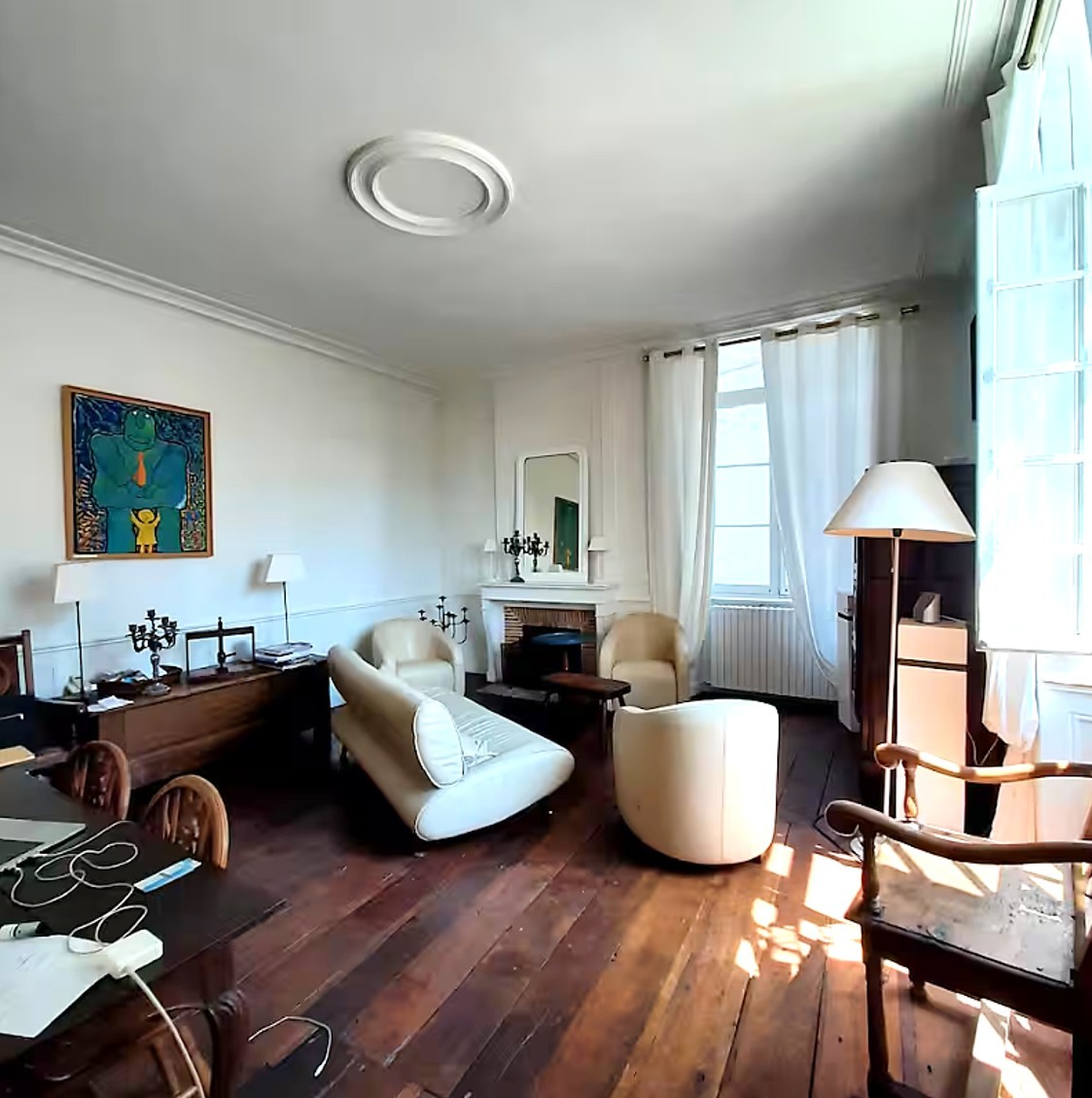 Living room with high ceilings and fireplace