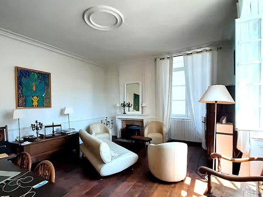 Living room with high ceilings and fireplace