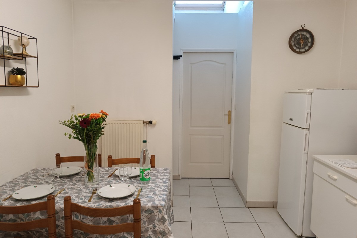 Cuisine et coin repas - Appartement RDC
