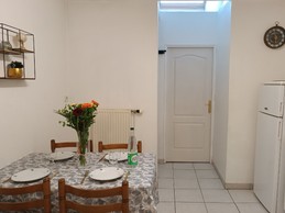 Cuisine et coin repas - Appartement RDC