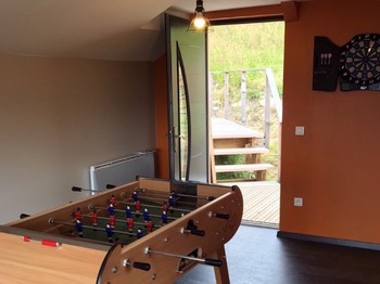 Lovely separate games room with table football, darts, sofa, music, Playmobils, games and books. All with a panoramic lake view!