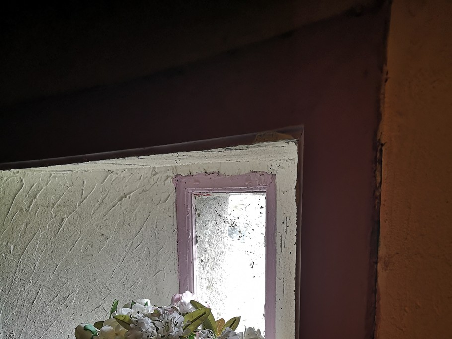 In the tower of the old staircase, a flower-filled alcove