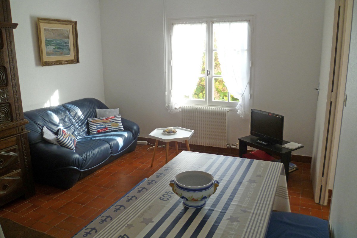 Living room with dining area and lounge with TV and WIFI internet access