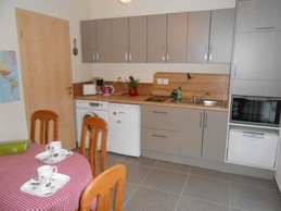 une cuisine commune aux 2 chambres