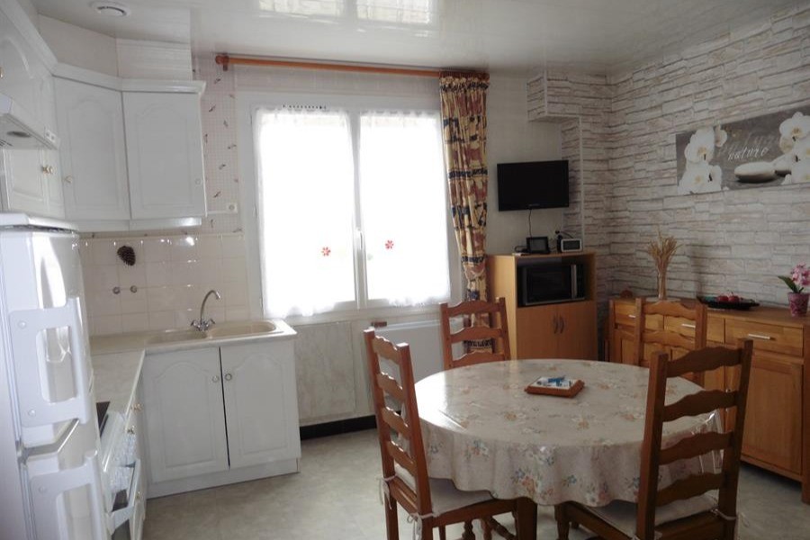 Kitchen opening onto living room