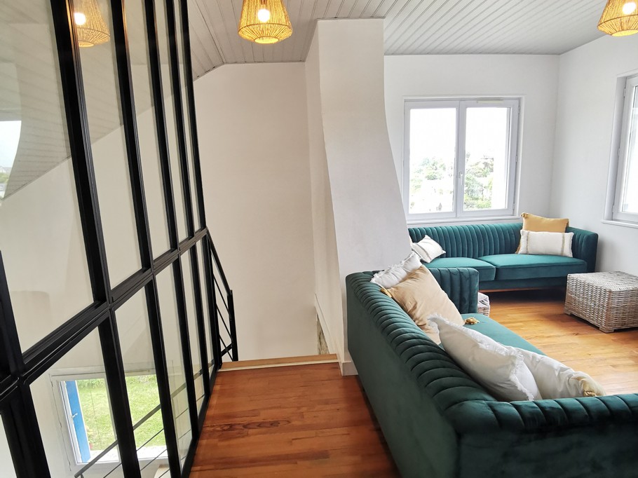 Living room with TV upstairs