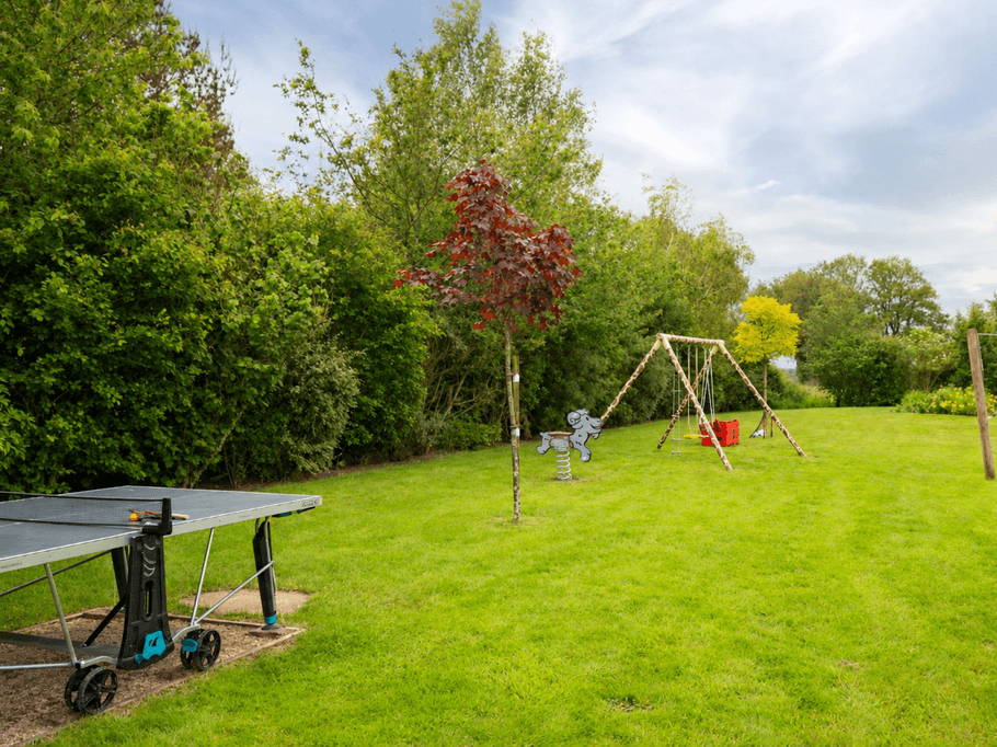 Leisure park with a pétanque court, volleyball court, swing, spring-loaded playground equipment, table tennis table…