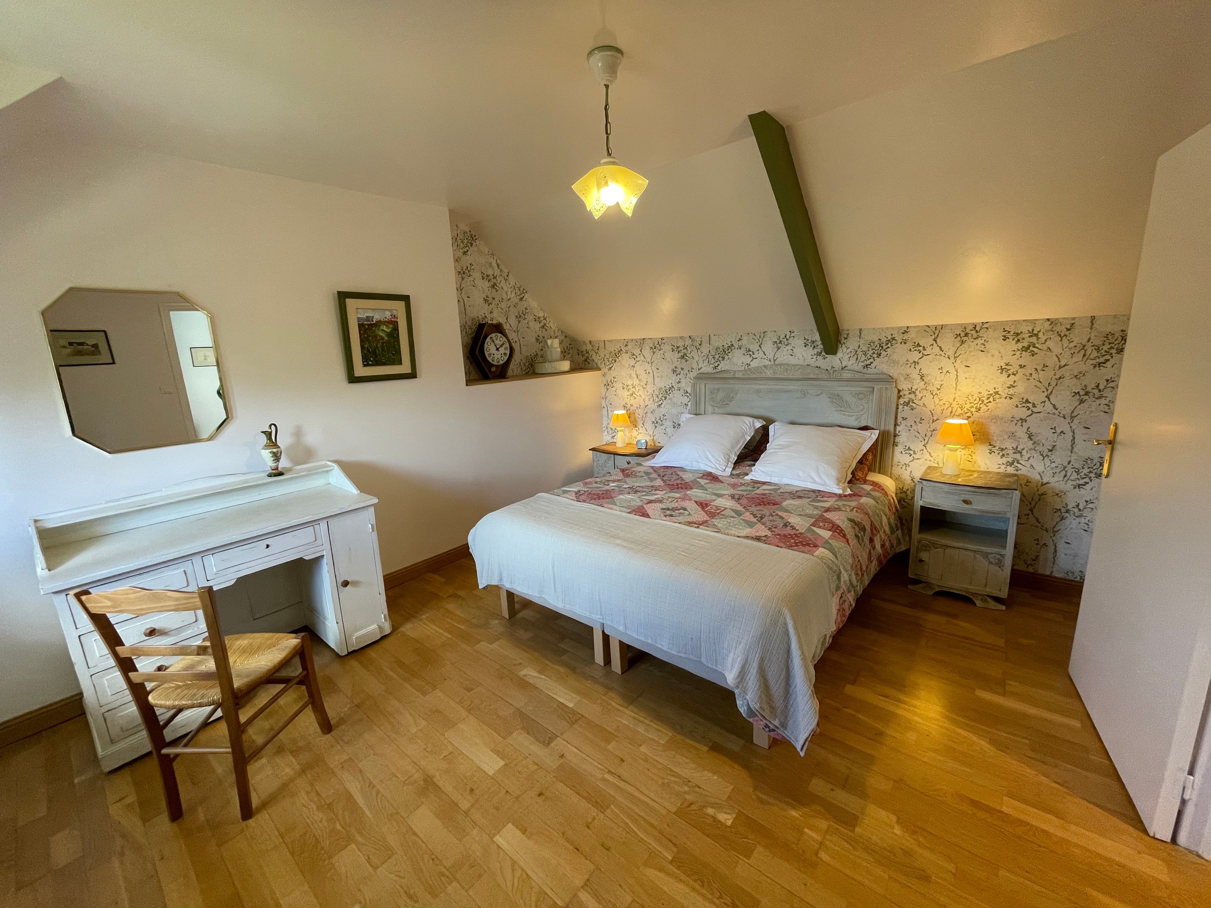 Upstairs, there is a bedroom with a 160cm bed