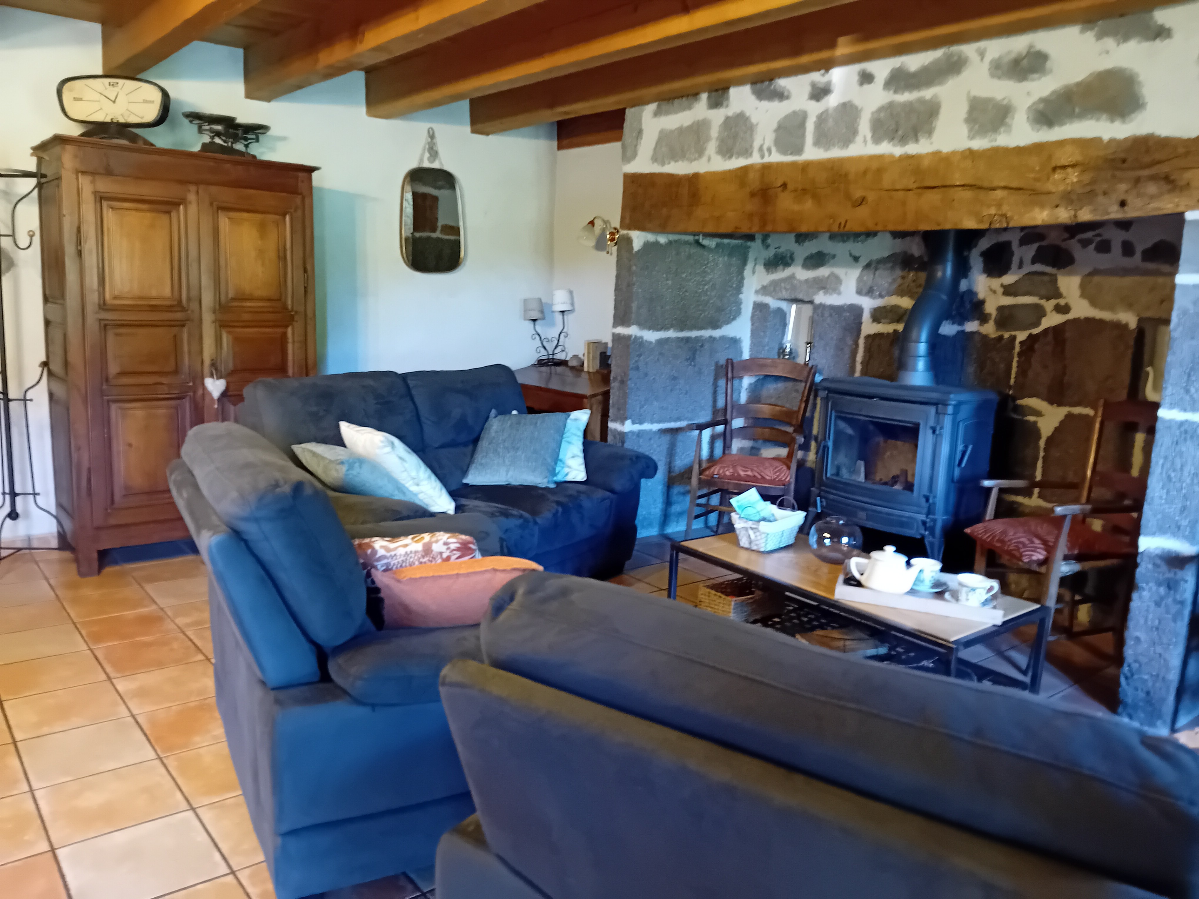 the cosy living room with the inglenook fireplace