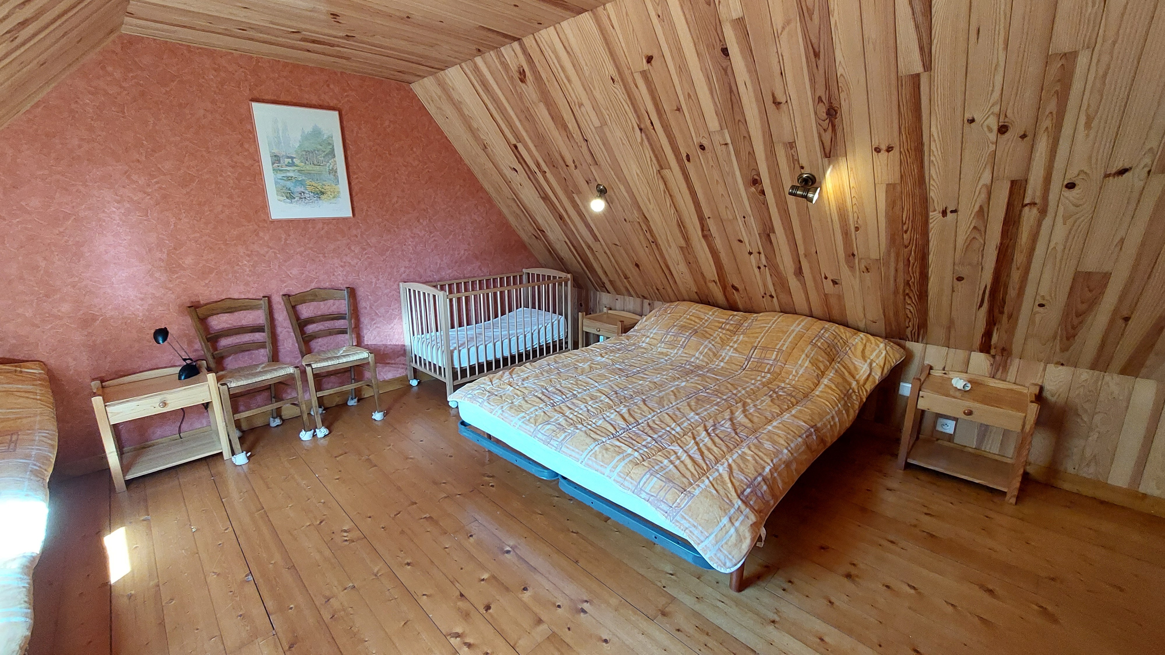 Attic bedroom with cosy wooden ambience