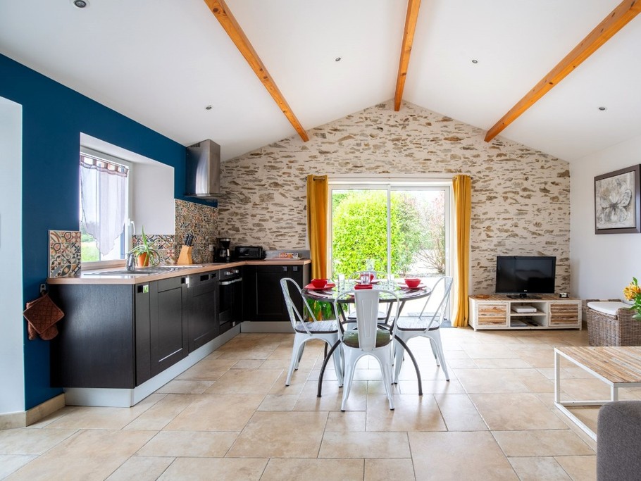 Living room, kitchen and sitting area with sofa bed.