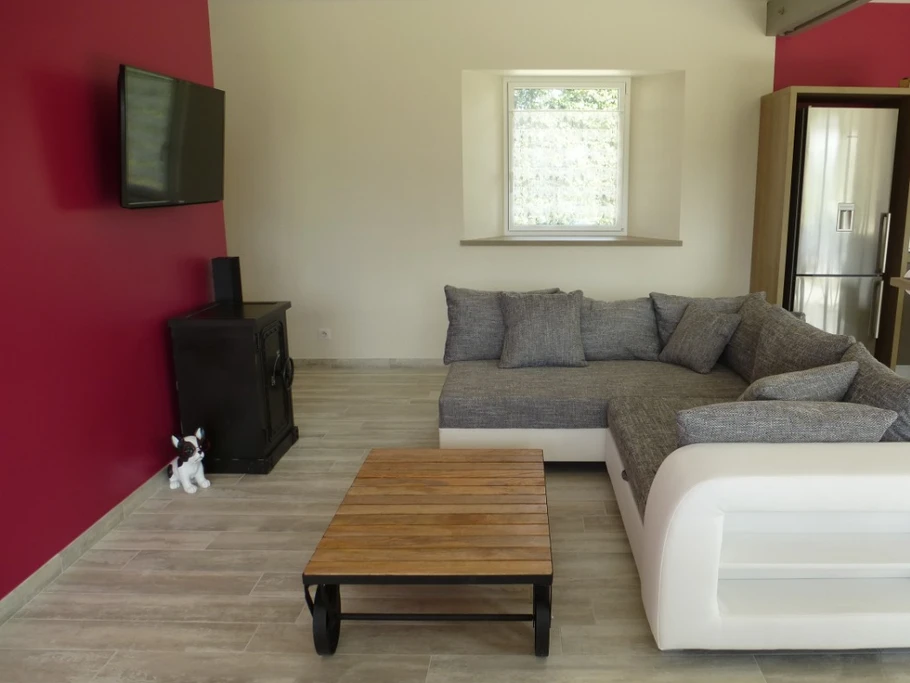 Living room with sitting area and TV.