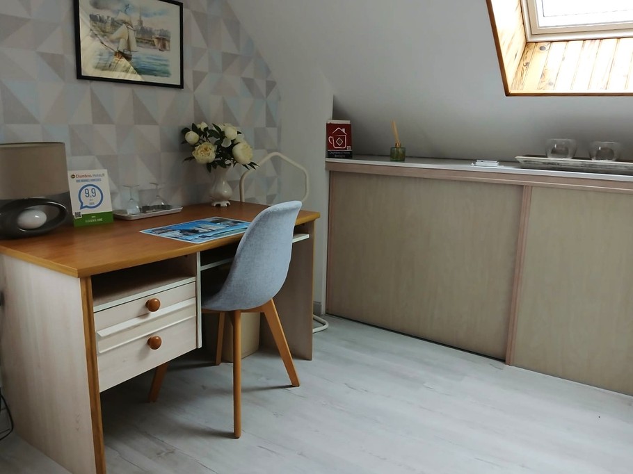 Bedroom 1 - 140 x 190 cm bed with desk, kettle and tea set, TV, wardrobe and chest of drawers.