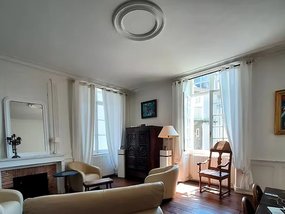 Living room with high ceilings and fireplace