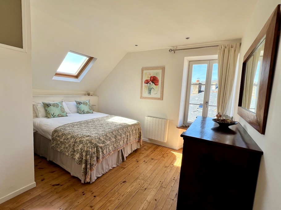 The second bedroom has a king-size bed with a view of Lyvet Harbour.