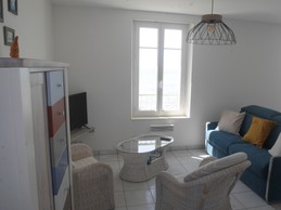 Salon avec canapé lit