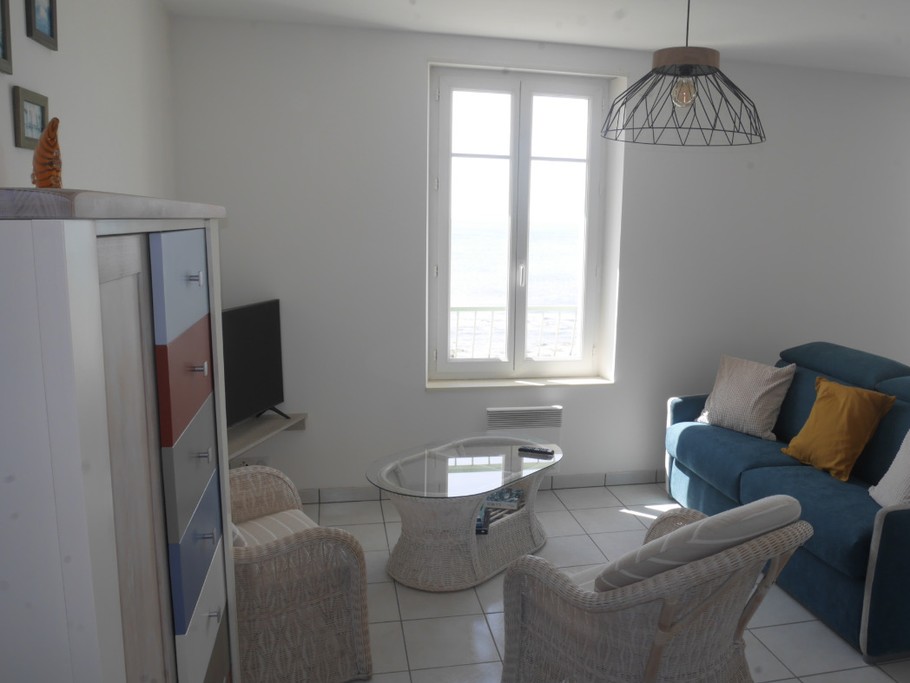 Salon avec canapé lit