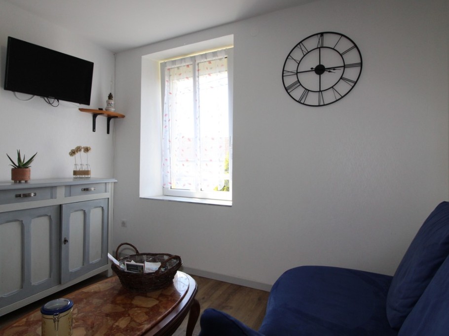 Coin salon - Appartement Chez Reine - Location de vacances - Étival-Clairefontaine