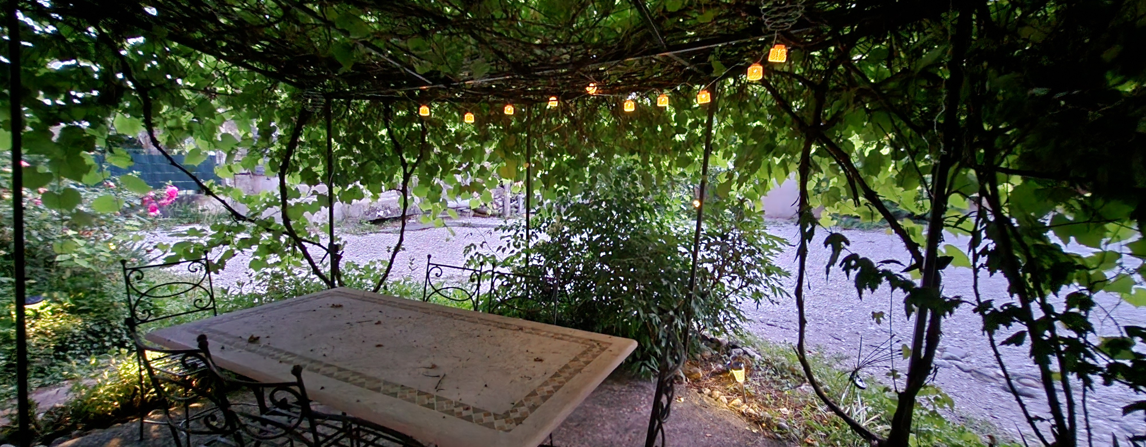 The pergola welcomes you into the inner courtyard