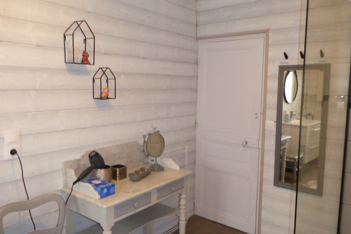 Spacious shower room with walk-in shower, vanity unit and wall-hung WC.