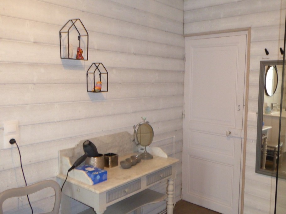 Spacious shower room with walk-in shower, vanity unit and wall-hung WC.