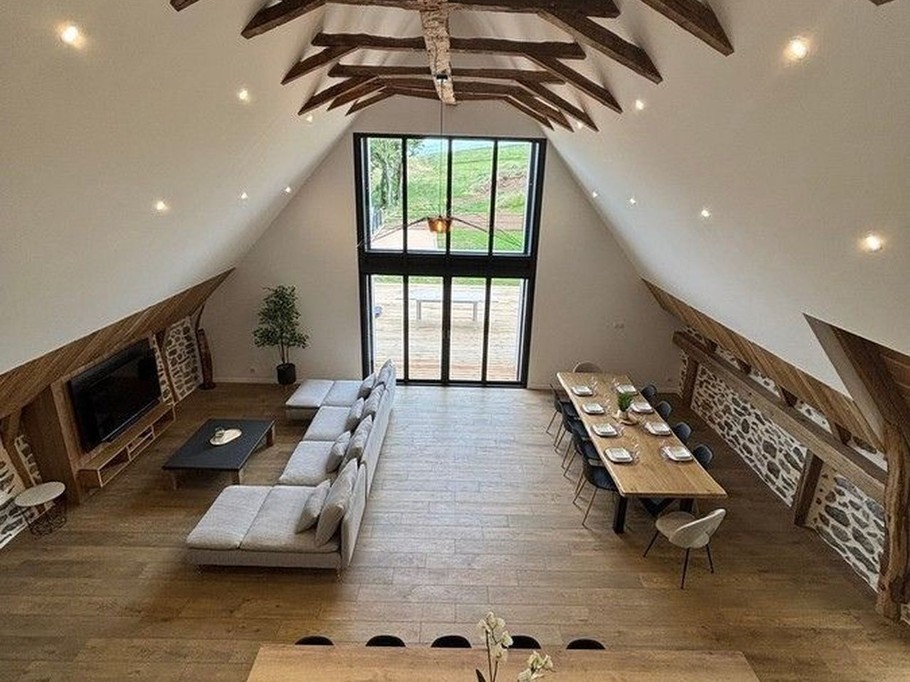 View of the living room, lounge and open-plan kitchen with floor-to-ceiling windows