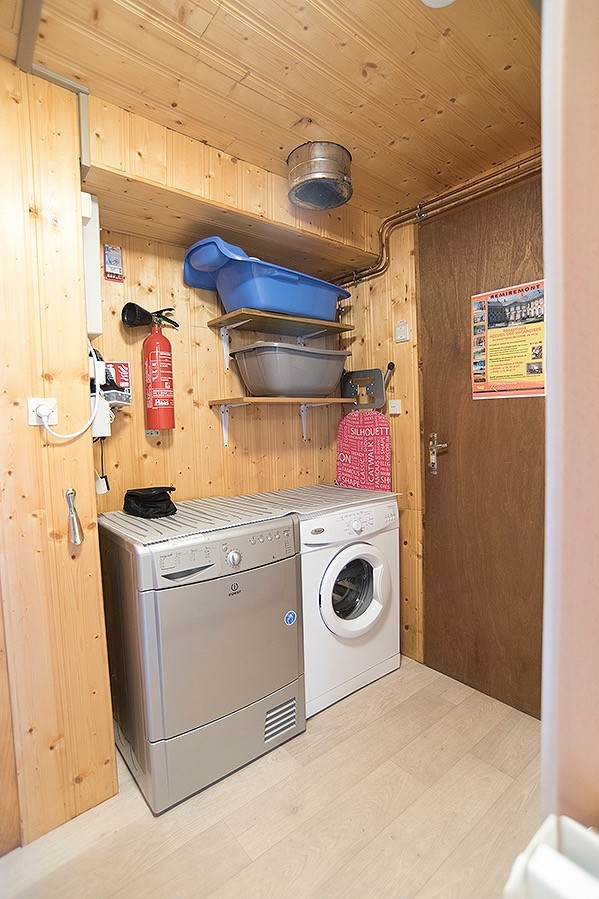 Cellar equipped with tumble dryer and washing machine