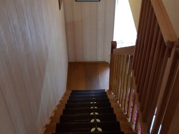 Staircase with anti-fall baby gate.