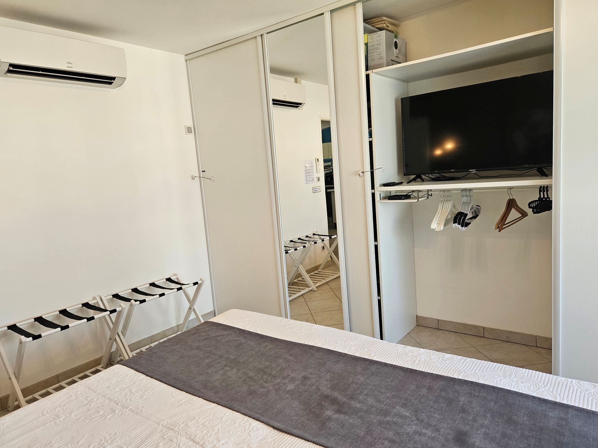 In the large wardrobe in the bedroom, there is a personal television
