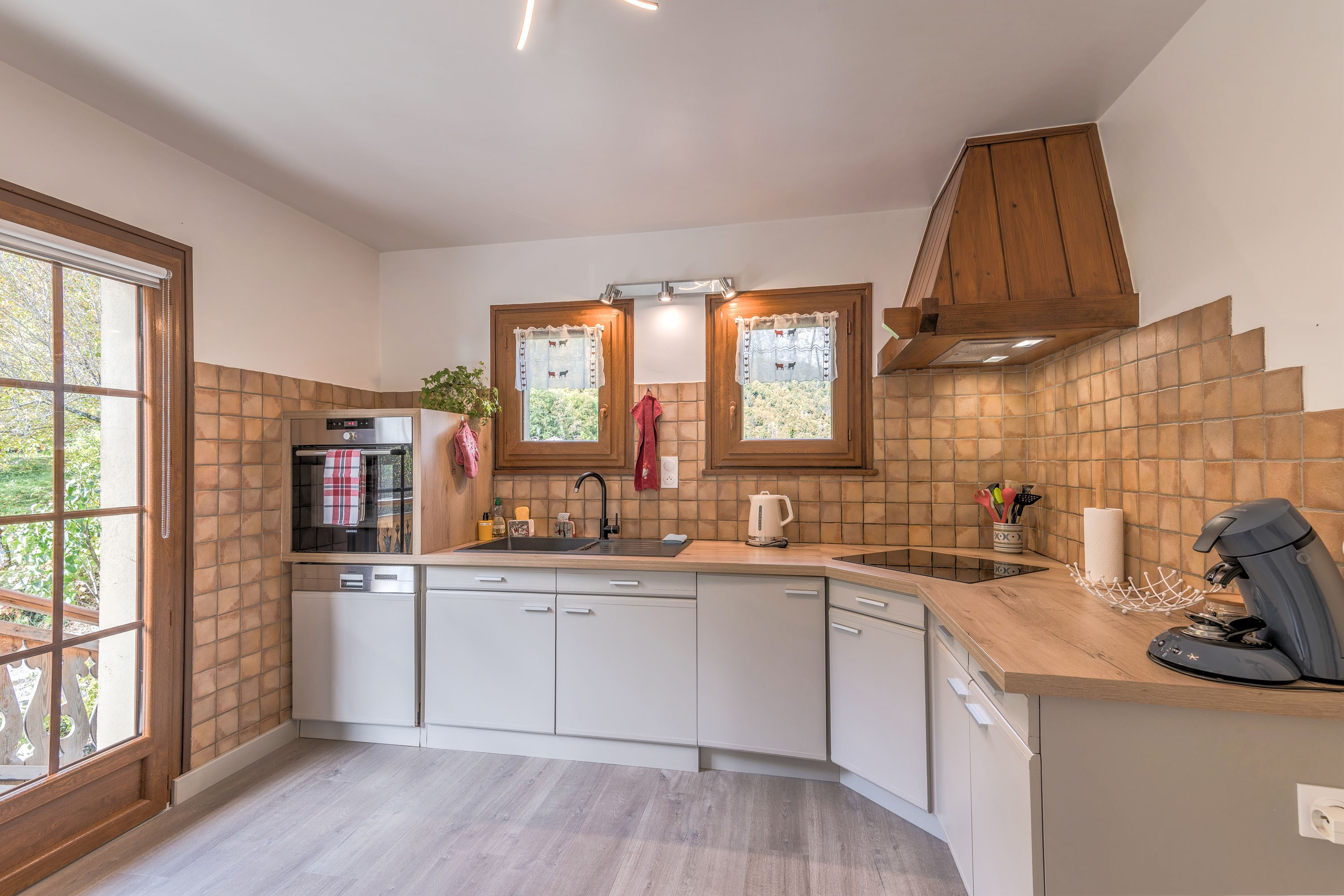 Kitchen with access to a west-facing balcony and terrace